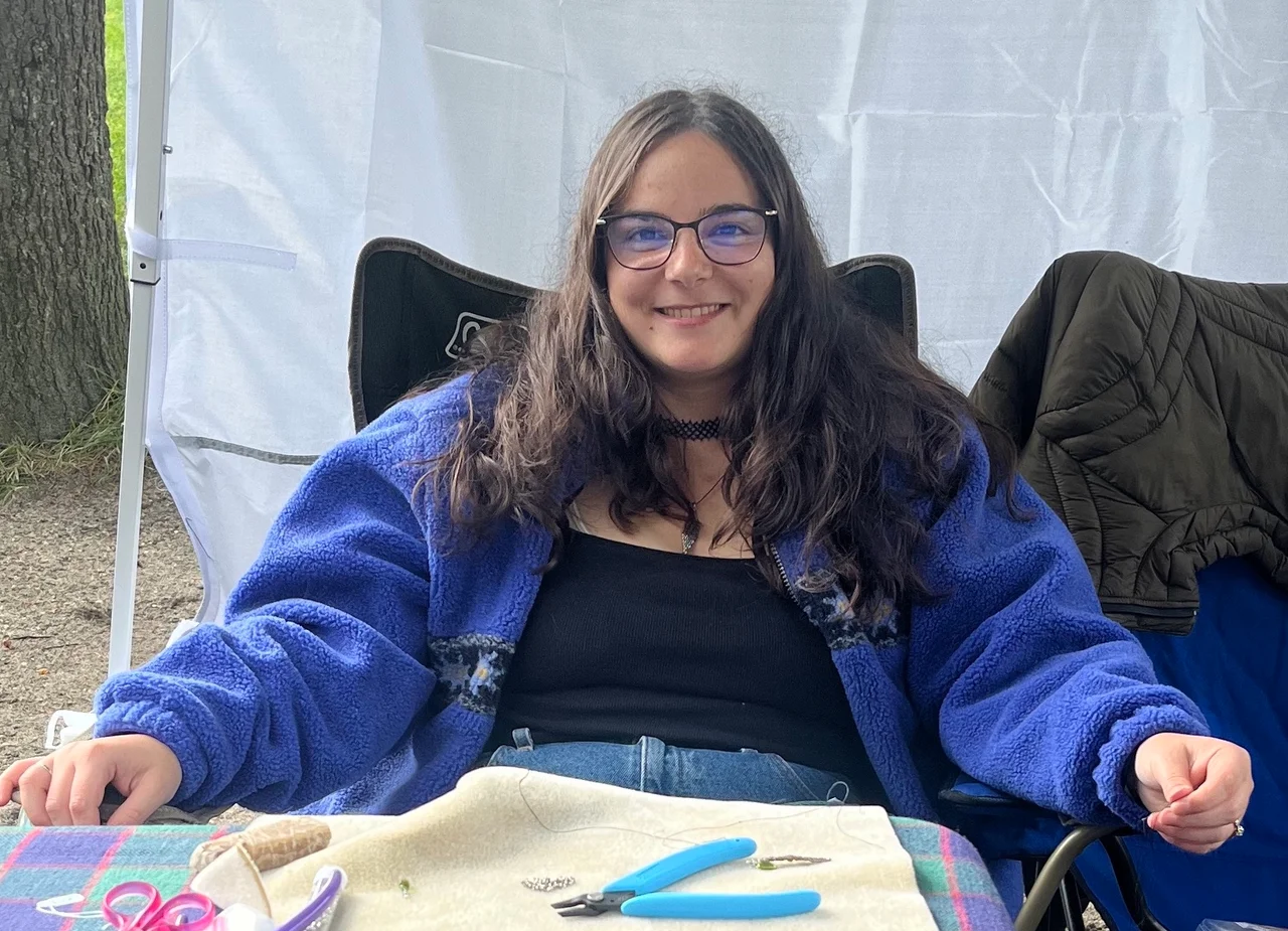 Shana Weissman working at her craft fair booth
